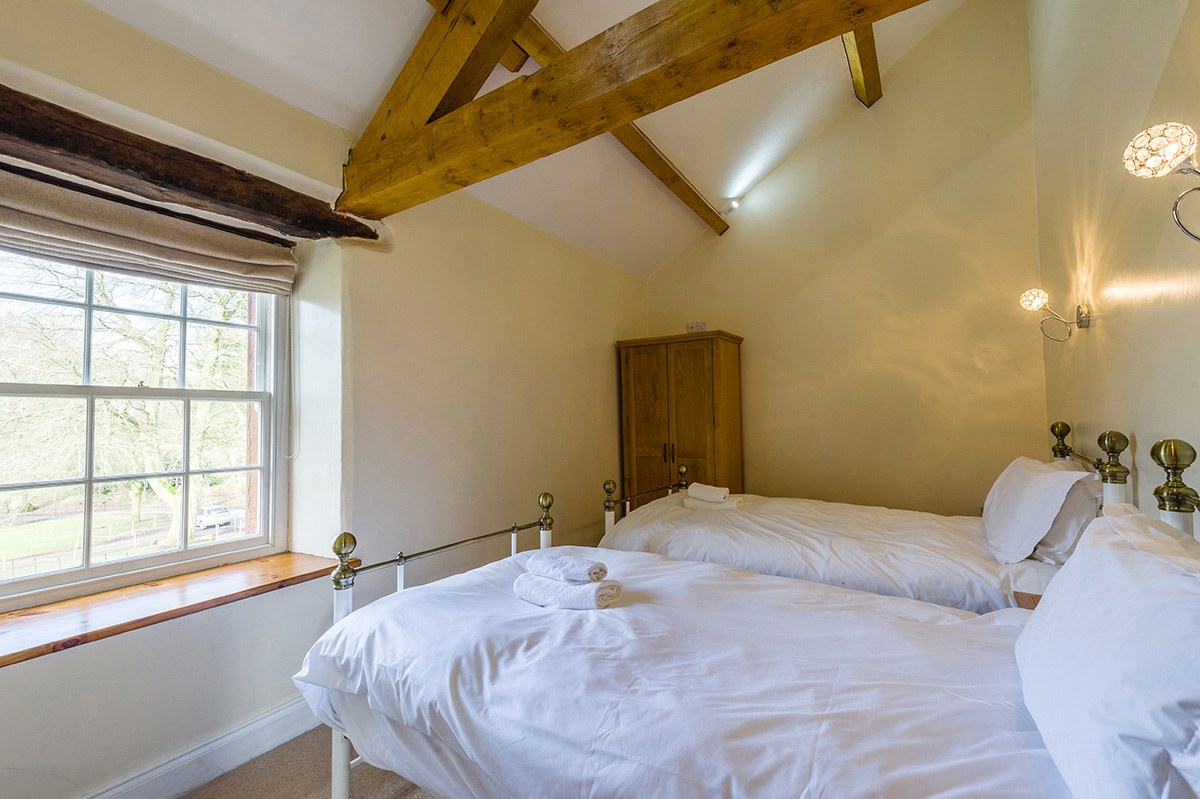 2 single brass beds in the self-contained holiday cottage at Appleby Castle
